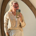Beige trui met pailletten
