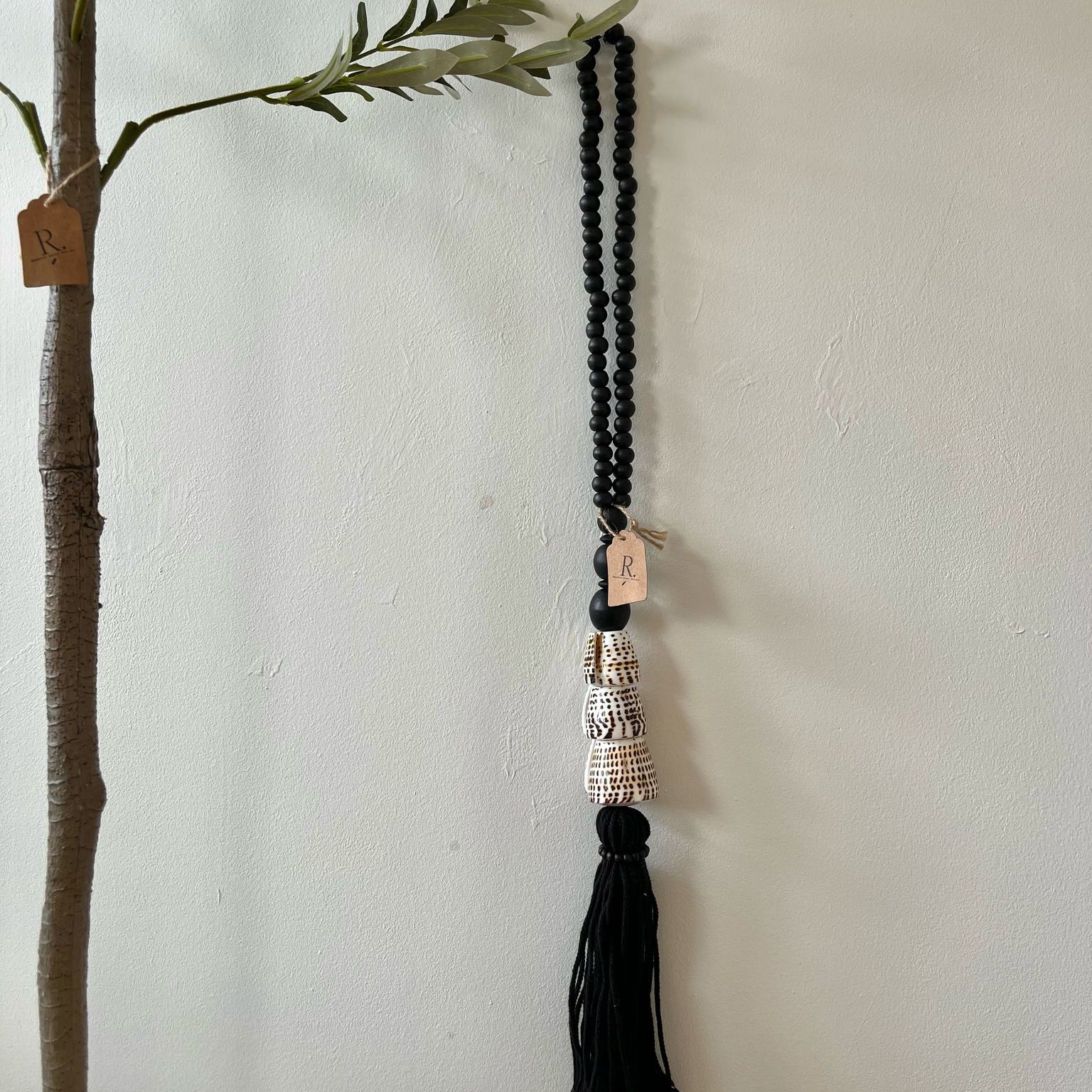 Schelpen tassel zwart